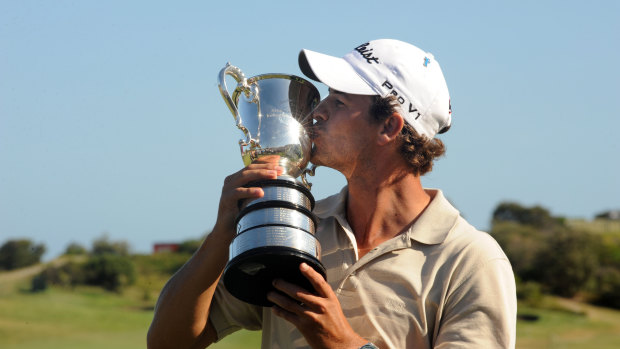 Champion: Adam Scott holds up the Stonehaven Cup in 2009.