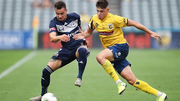 Hard yards: Victory goalscorer Kristijan Dobras tries to find a way past Daniel De Silva of the Mariners.