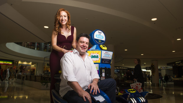 Kristen Henry and Nigel Johnson at Westfield Belconnen on Thursday. Johnson said he had missed the fun and spontaneity of radio.