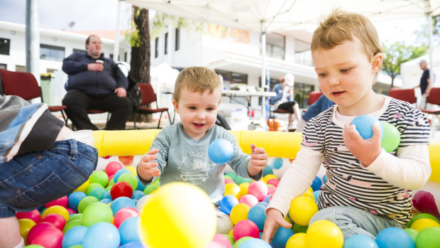 Mason Hutton, one, and Chloe Carwardine, two, in the play area run by the Salvation Army at SouthFest on Saturday.