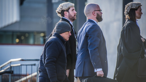 David Eastman, left, arrives at court with his legal team earlier in this trial.