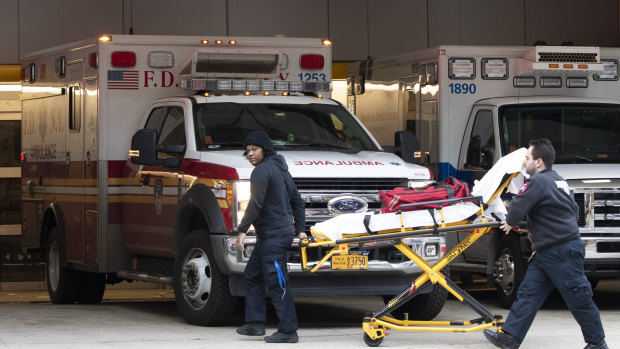 Emergency Medical Technicians wheel a collapsible stretcher into the emergency room at NewYork-Presbyterian Lower Manhattan Hospital.