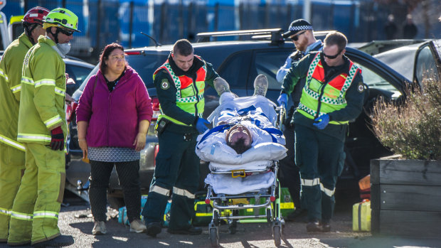 Police, paramedics and firefighters attend the scene of a four-car crash in Fyshwick on Wednesday morning.