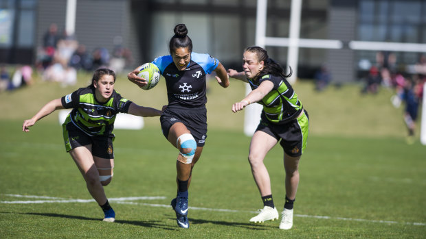 University of Canberra's Ngawai Eyles makes a break. The campus hopes the sevens will one day be played on a boutique stadium.