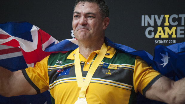 Ben  Farinazzo collects one of his two gold medals at the 2018 Invictus Games