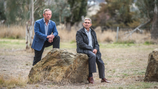 Former Flynn neighbours Robin Eckermann and Peter Toscan are concerned about the impact of a former sheep dip site near their former homes in Fraser. The men, who have both had cancer, are pictured at the end of their street.