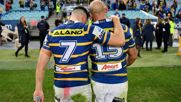Mitchell Moses and Tim Mannah together after a game against the Bulldogs in 2018.