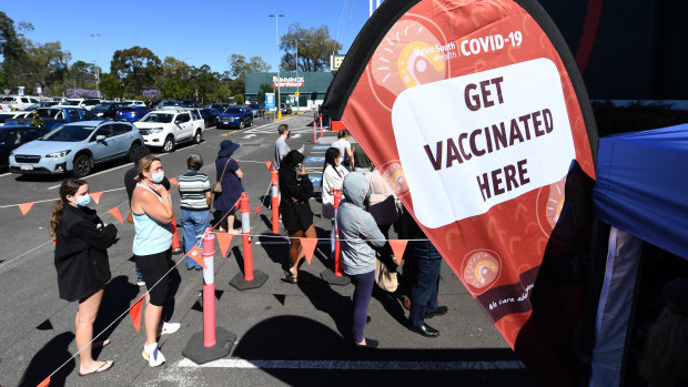 People queuing to get a COVID-19 vaccine at a Bunnings clinic.