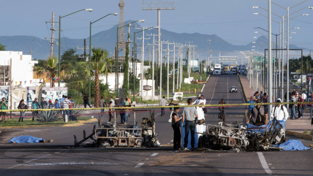 September 2016: police examine a military convoy in Culiacan, Mexico, ambushed with grenades and high-powered guns, killing five soldiers. Authorities attributed the ambush to the sons of Joaquin "El Chapo" Guzman.