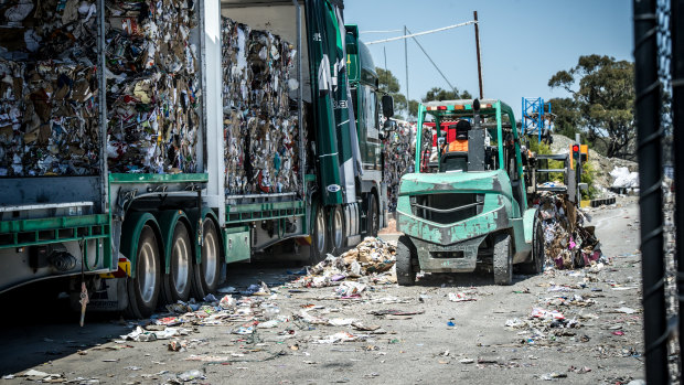 A truck at the Hume recycling facility is loaded with bales of compressed recyclables. Tonnes of recyclable material was dumped into landfill to make additional space.