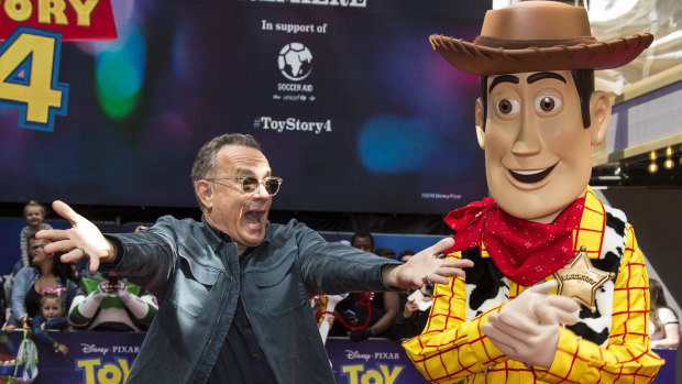 Tom Hanks hams it up with the "real-life" Woody at the premiere of Toy Story 4.