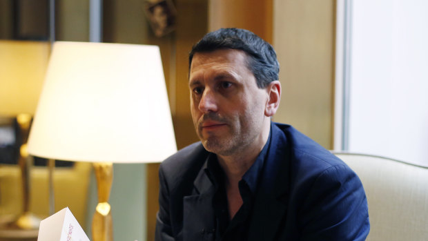 French writer Frederic Martel gestures during an interview with Associated Press, in Paris.