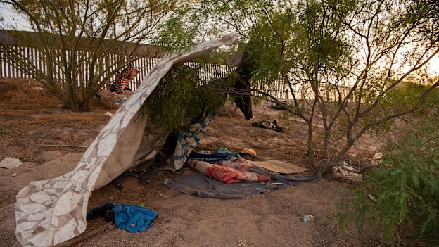 One day before Title 42 is set to be lifted, makeshift shelter and items are left behind by migrants along the US side of the wall in El Paso, Texas. 