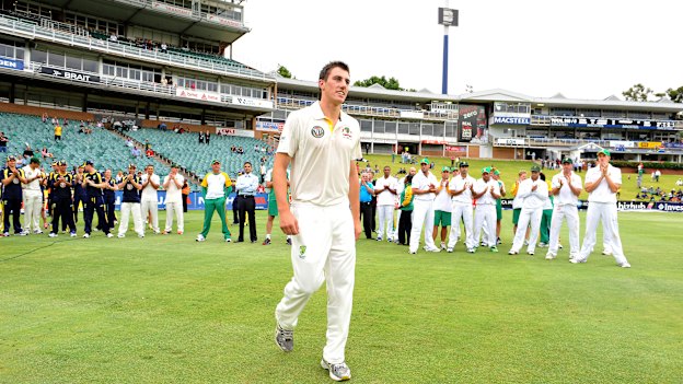Cummins winning the man of the match award on his Test debut, against South Africa in 2011.