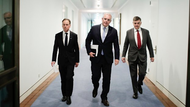 Health Minister Greg Hunt, Prime Minister Scott Morrison and Chief Medical Officer Professor Brendan Murphy in early March.