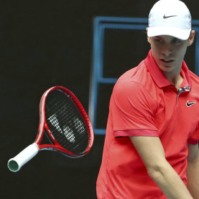 Denis Shapovalov throws his racquet in frustration during his first round match against Marton Fucsovics at the Australian Open.