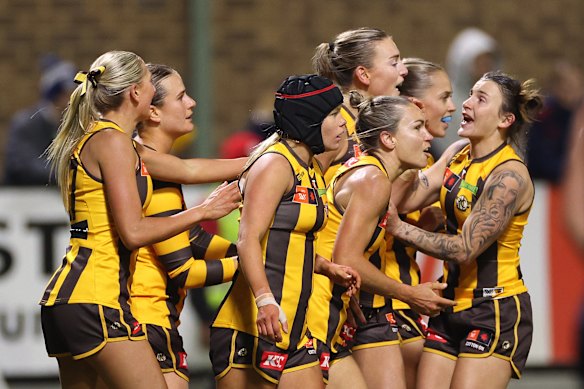 Aine McDonagh and her Hawks teammates celebrate a crucial goal.