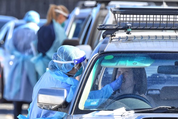 A woman is tested at the drive-through COVID-19 testing site at Bondi Beach this month.