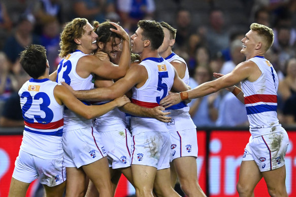 Josh Bruce is congratulated by teammates during his goal feast.