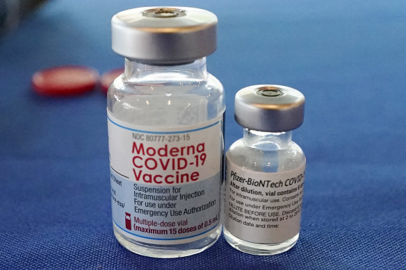 Vials of the Pfizer and Moderna COVID-19 vaccine.