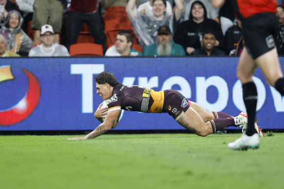 Reece Walsh scores for the Brisbane Broncos against the Canberra Raiders.