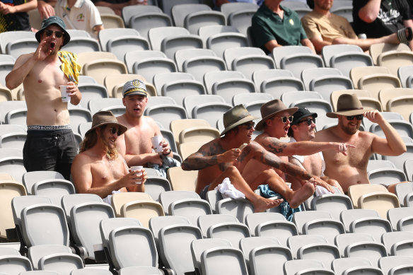 Fans watch the game