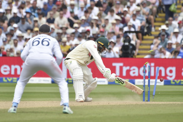 Ollie Robinson knocks over Usman Khawaja for 141.