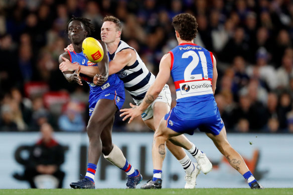 Buku Khamis is tackled by Mitch Duncan.