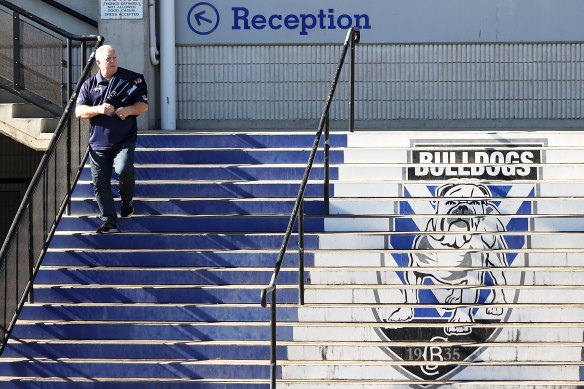 Phil Gould walks down the stairs at the club’s Belmore headquarters.