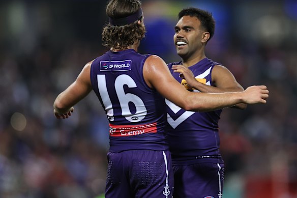 Isaiah Dudley of the Dockers celebrates with Murphy Reid after scoring a goal.