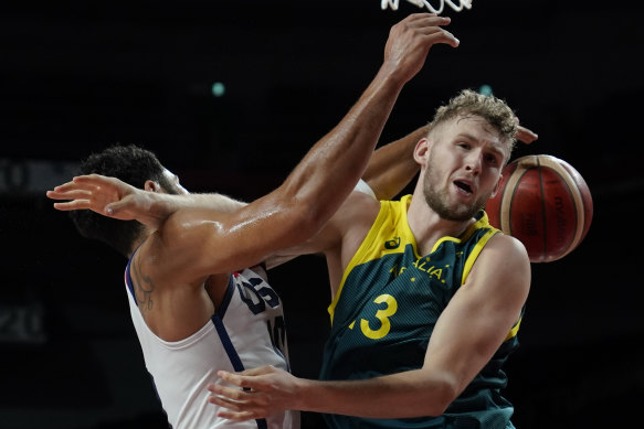 Jayson Tatum and Jock Landale collide.