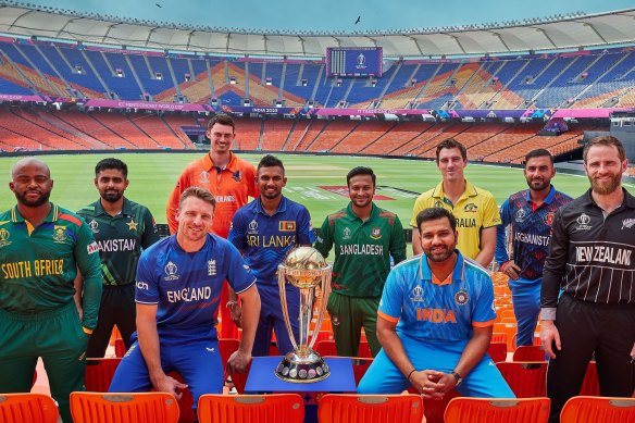 The countdown is over. Captains pose for a photo before the 2023 ICC World Cup.