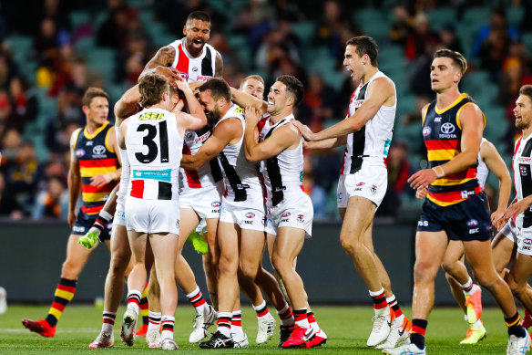 St Kilda players come from everywhere to celebrate Dougal Howard's first goal in club colours.