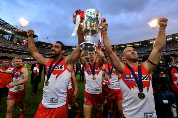 Jarrad McVeigh celebrates Sydney’s 2012 AFL grand final win with co-captain Adam Goodes.