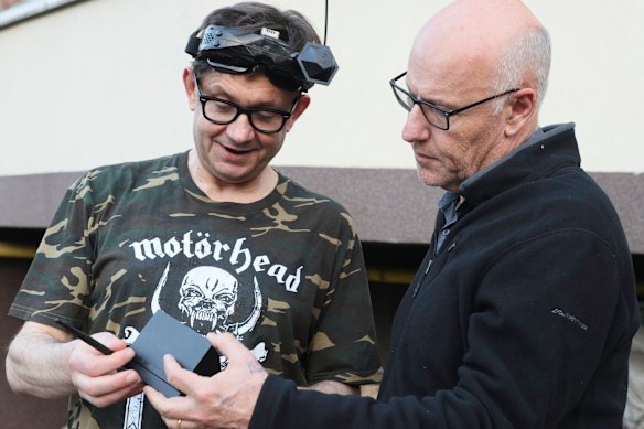 The author (right) and Oleksandr Pipa, a punk rocker who now works with Chernysh.