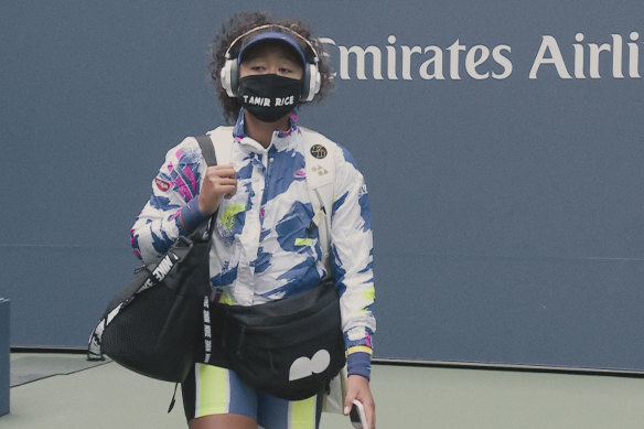 Osaka enters the arena for the 2020 US Open wearing a facemask bearing the name of Tamir Rice, a 12-year-old boy who was shot dead by police in Cleveland in 2014.