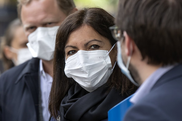 Paris mayor Anne Hidalgo and other officials in Paris on Tuesday after the easing of restrictions.