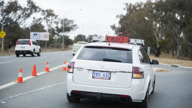 Three cars and a truck crash on Monaro Highway and Mugga Lane. 