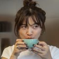 Maggie Li, 27, drinks a flat white at Cafe del Volcan.