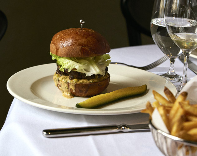 A cheeseburger and beer on tap is part of the relaxed offering.