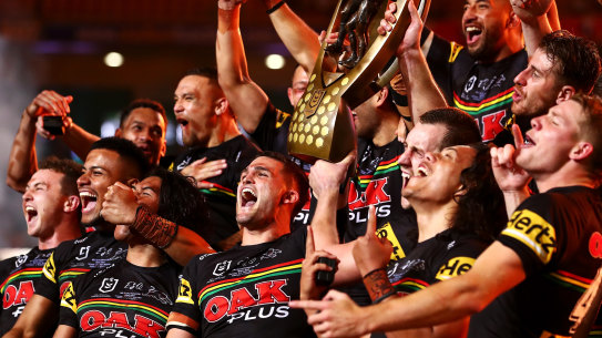 The Panthers celebrate with the NRL Premiership Trophy after victory in the 2021 Grand Final in Brisbane.