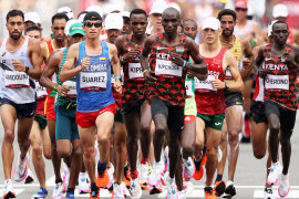 Eliud Kipchoge (centre) competes in the men’s marathon at the Tokyo 2020 Olympic Games. Kipchoge won the race with a time of