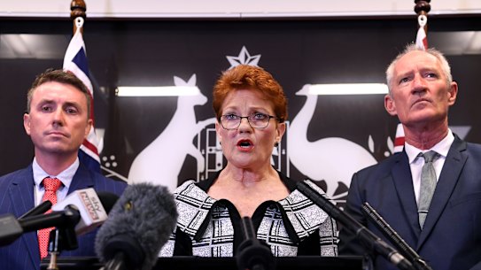 One Nation leader Pauline Hanson, flanked by party officials James Ashby (left) and Steve Dickson on Thursday.