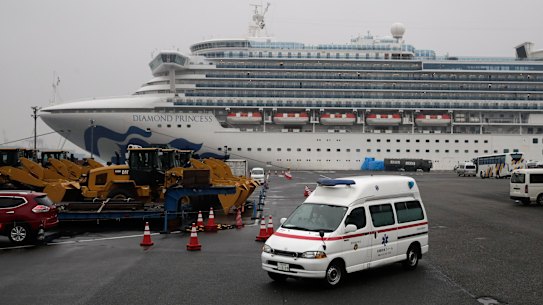 An ambulance leaves the port where the quarantined Diamond Princess cruise ship is docked. 