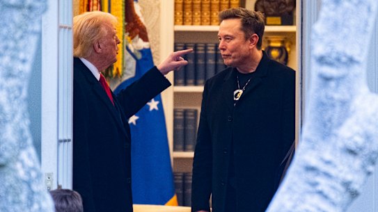 Elon Musk and Donald Trump speak in the White House on March 14.