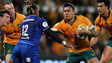 Len Ikitau of the Wallabies runs the ball.