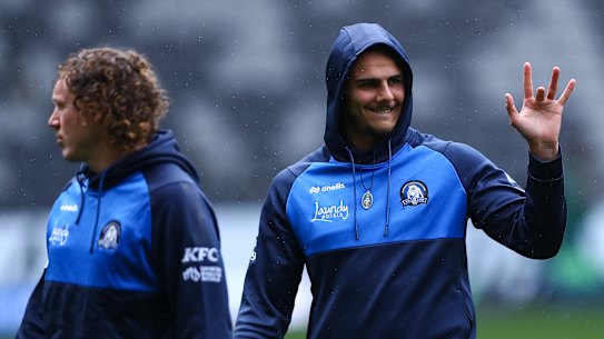 Jacob Kiraz gives Adam Doueihi a khawd before the game on Sunday.