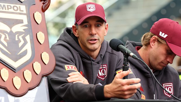 Billy Slater sitting next to Cameron Munster at the press conference where he returned serve against Aaron Woods.