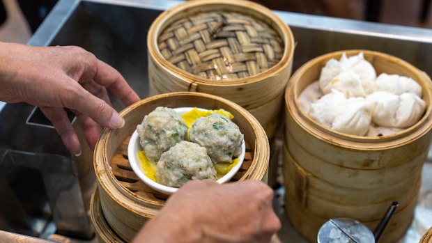 Dim sum steamer baskets fly off the food carts.