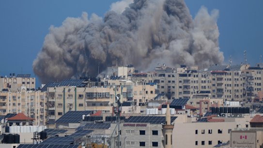 Smoke rises after an Israeli air strike in Gaza City on Thursday.